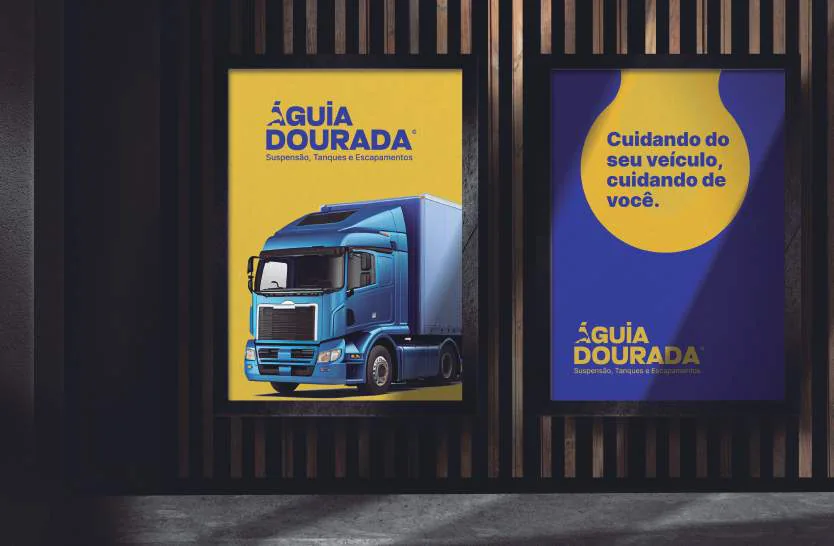 Aplicação da identidade Águia Dourada em dois painéis, com caminhão e peças em azul e amarelo.